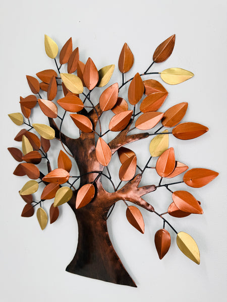 Angled view of metal oak tree wall art showing leaf texture and warm colours