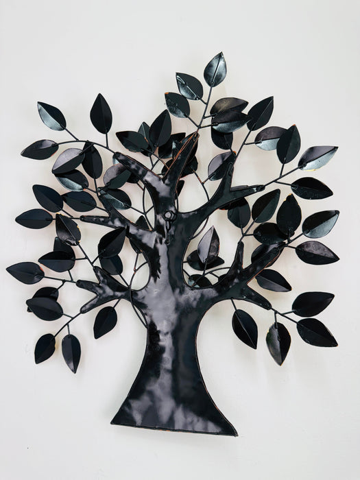 Back view of the metal oak tree wall sculpture showing mounted frame and hanging eyelets