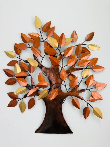 Metal tree wall art with autumn leaves on a white background