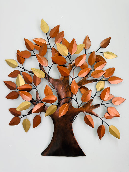 Metal tree wall art with autumn leaves on a white background