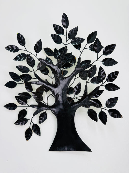 Back view of metal willow tree wall art showing the mounted frame and hanging eyelets