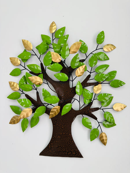 Decorative wall art of a tree with green and gold leaves on a white background