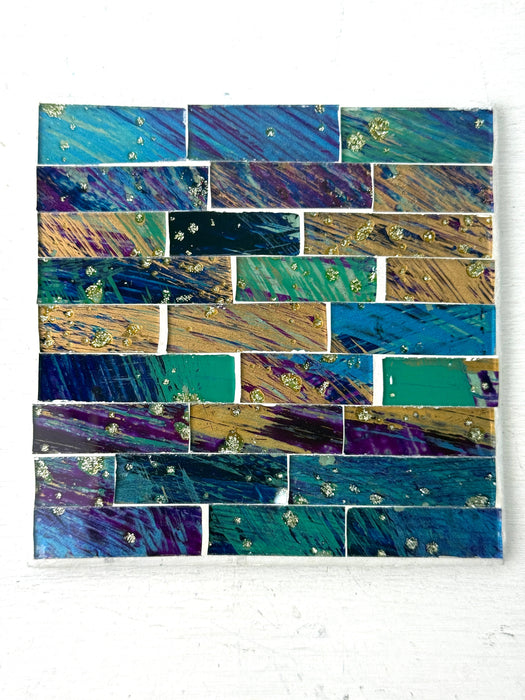 Square Cyan Brick mosaic coaster with hand-painted glass rectangles in blue and green tones arranged on an MDF base, photographed from above on a light surface.