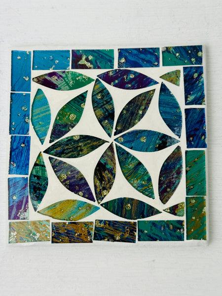 Square Cyan Peacock mosaic coaster with hand-painted glass pieces in blue and green tones arranged in a geometric pattern on an MDF base, photographed from above.