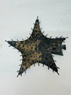 Back view of metal starfish showing eyelet for wall mounting