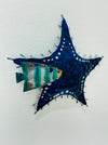 Side-angle view of blue metal starfish showing painted detail