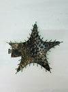 Back view of green metal starfish showing hanging eyelet