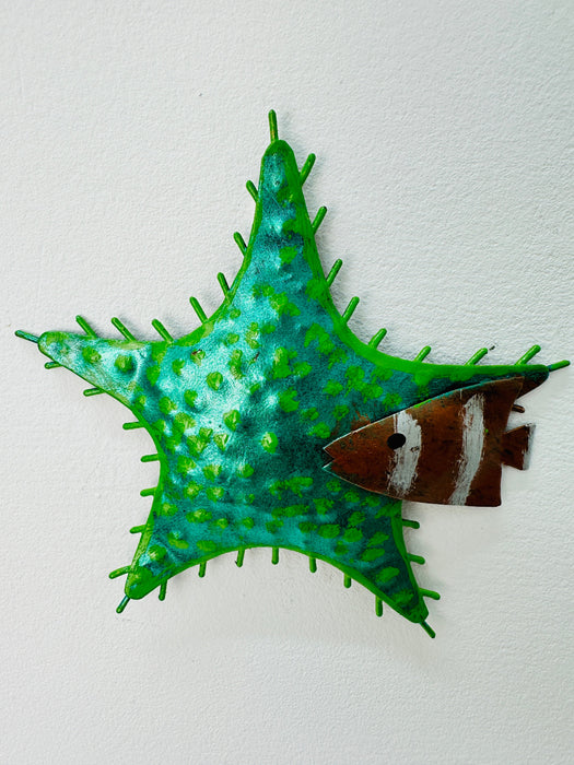 A hand-painted green metal starfish wall decoration with a unique textured finish.