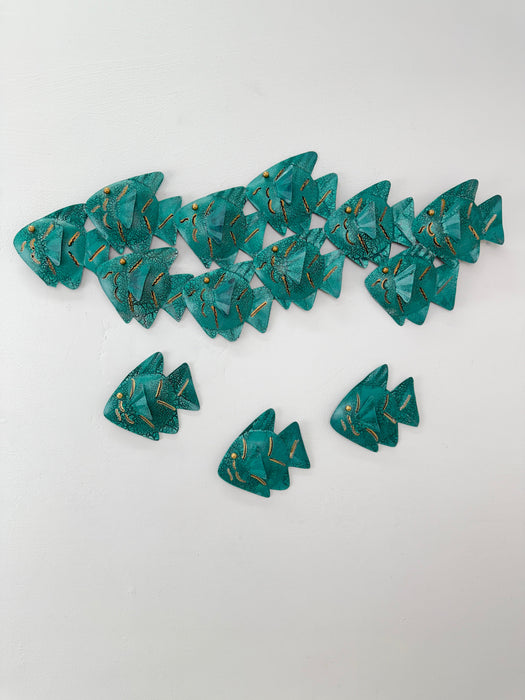 Turquoise crackle fish shoal displayed together with three single matching fish pieces