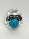 Silver ring with a turquoise stone on a white background