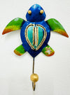 Handmade blue and green metal turtle wall hook with gold detailing.