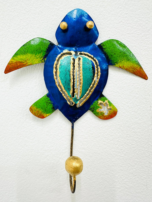 Handmade blue and green metal turtle wall hook with gold detailing.