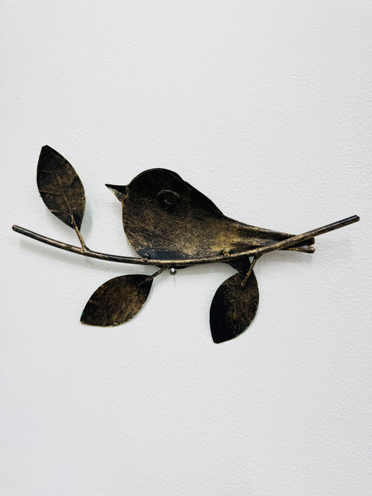 Back view of the metal robin wall art showing twig, leaf details and eyelet mounting