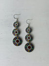 flat lay of coloured enamel dangle earrings