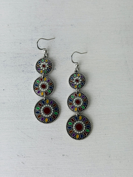 flat lay of coloured enamel dangle earrings