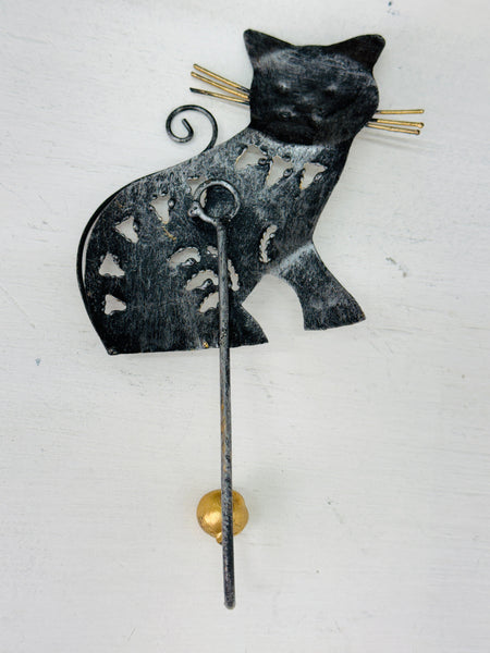 Back view of handmade metal cat wall hook.