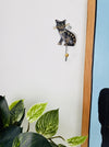 Handmade cat wall hook styled with plants.