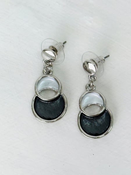 white and grey drop earrings with circular design.