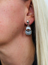 White and grey drop earrings with circular design.