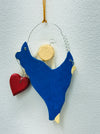 Back of the blue angel Christmas ornament showing hanging loop and plain finish.