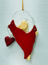 Back of the red angel Christmas ornament showing hanging loop and plain finish.