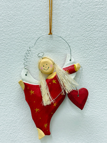 Hand-painted red angel with gold stars and red heart.