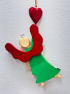 Back view of wooden hanging angel with gold string and red heart.