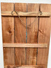 Back of Black Cat wooden sign showing natural wood panels and hanging rope.
