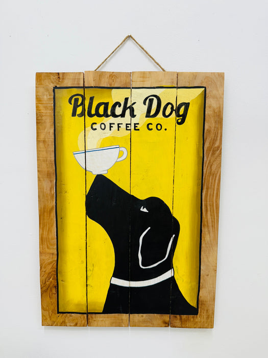 Hand-painted Black Dog wooden sign with coffee cup illustration and hanging rope on white background.