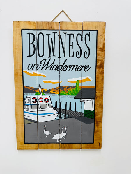 Hand-painted Bowness on Windermere wooden sign with lake illustration and hanging rope on white background.