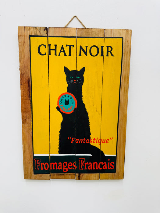 Hand-painted Chat Noir wooden sign with French cheese poster illustration and hanging rope on white background.