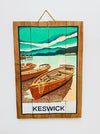 Hand-painted Keswick wooden sign with rowing boats illustration and hanging rope on white background.