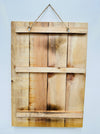 Back of Wiener Dog wooden sign showing natural wood panels and hanging rope.