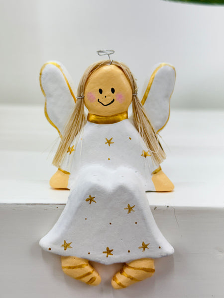 Sitting wooden angel in white with gold stars, shelf-sitter.