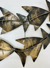 Back view of recycled metal zebra fish shoal wall sculpture.