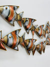 Close-up of hand-painted zebra fish detailing in mottled copper and gold tones.