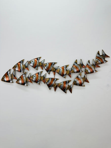 Hand-painted zebra fish shoal wall art in copper, gold and silver tones, front view.