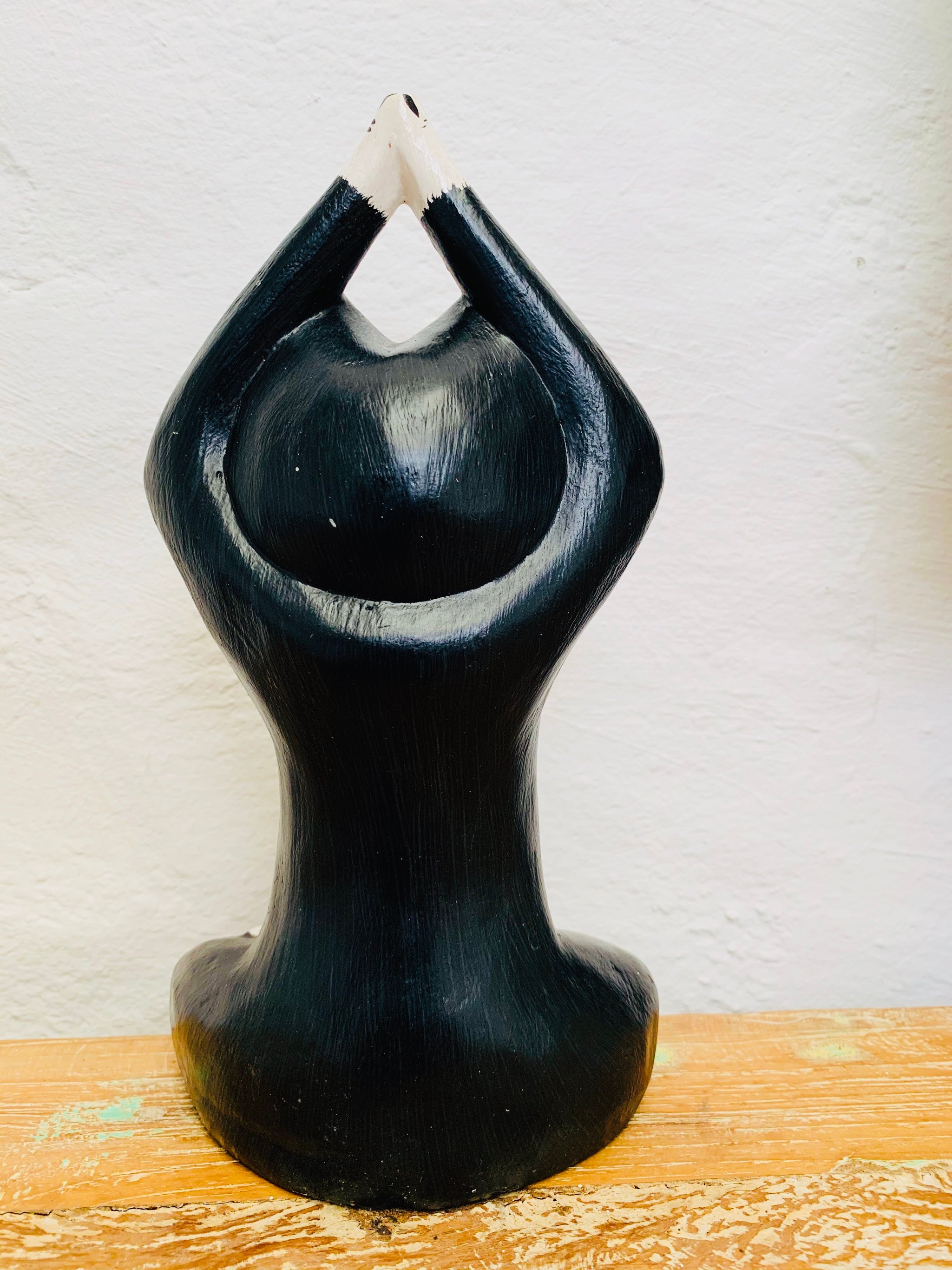 back view of wooden yoga kitty