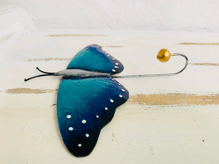 side close up of metal butterfly hook