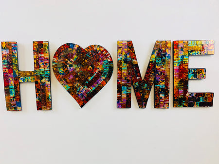 front view of mosaic home letters on white background