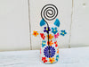 back close up view of wooden flower cow in white