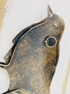 close up of back of robin with hook attached