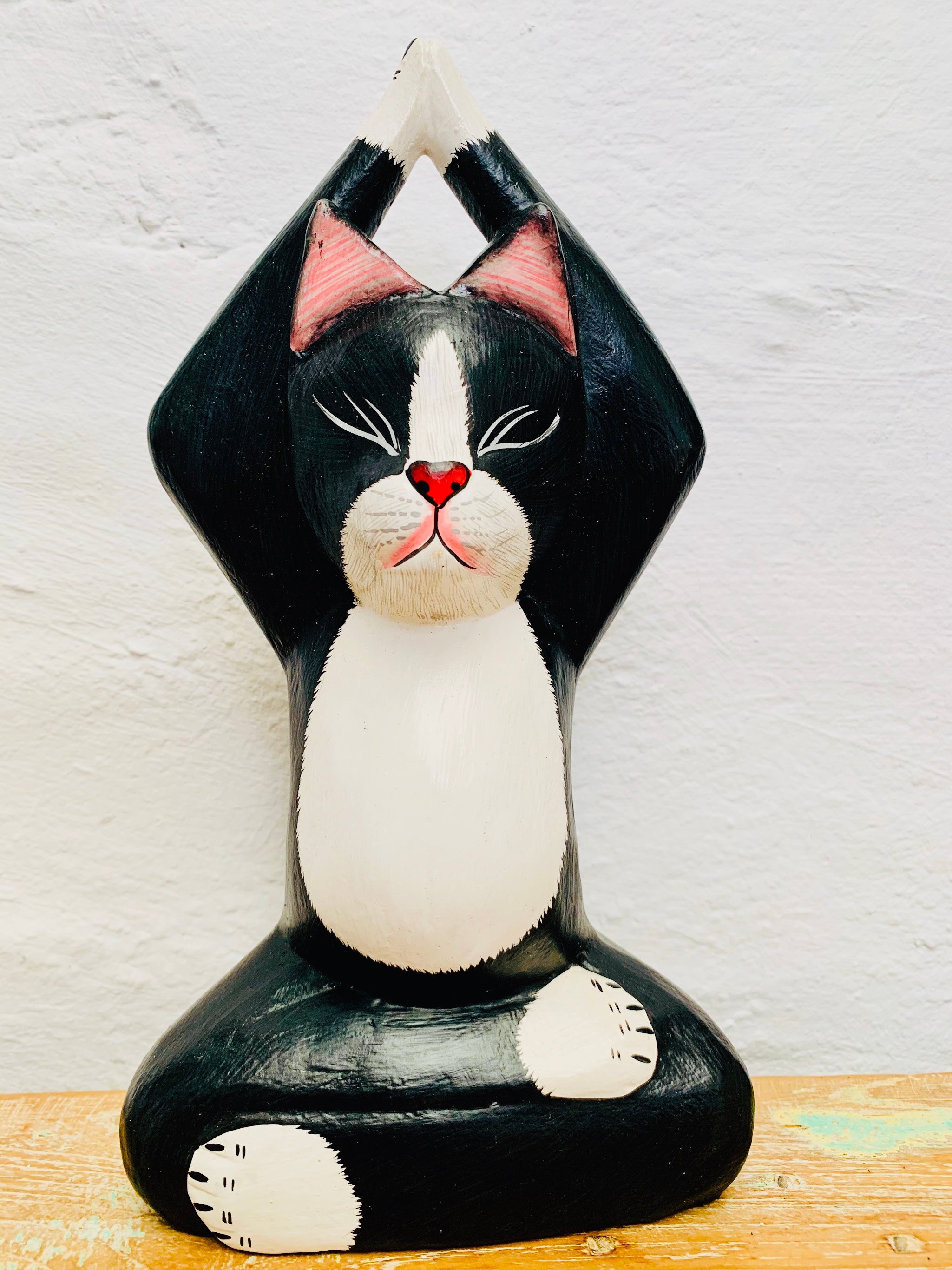 front view of wooden yoga kitty