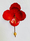 front view of red flower hook on wall