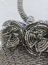 close up of beaded flowers on handbag