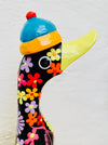 close up side view of wooden flower duck
