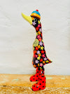 side view of wooden flower duck in black on white and wooden background