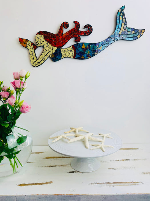 display view of mosaic mermaid on wall