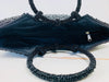 close up of beaded handbag opening