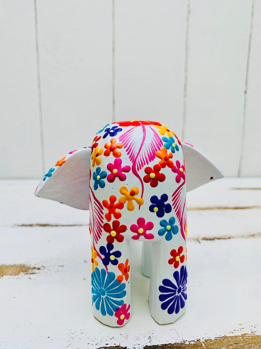 back view of wooden flower elephant in white